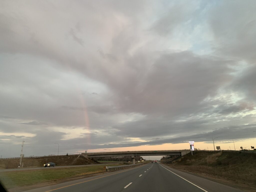 Rainbow over highway