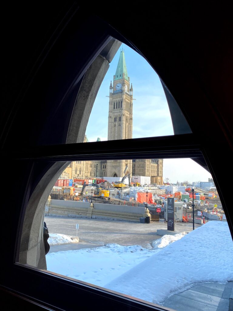 View of the Peace Tower in Ottawa from a gothic window in West Block of Parliament.